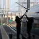 In this Tuesday Feb. 28, 2012 photo, a worker cleans exterior of a CRH high-speed train at Tianjin Railway Station in Tianjin, China. A section of a high-speed railway line that had already undergone test runs has collapsed in central China following heavy rains, the latest accident since a crash last summer that killed 40 people, state media reported Monday March 12, 2012. (AP Photo/Alexander F. Yuan)